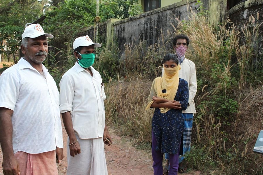 Elderly Landlord Vasudeva Shetty with Umesh Devadiga of `Aapadbandhava’ enquiring the wellbeing of tenants Shobha, Lingappa in Tadambail near Suratkal.