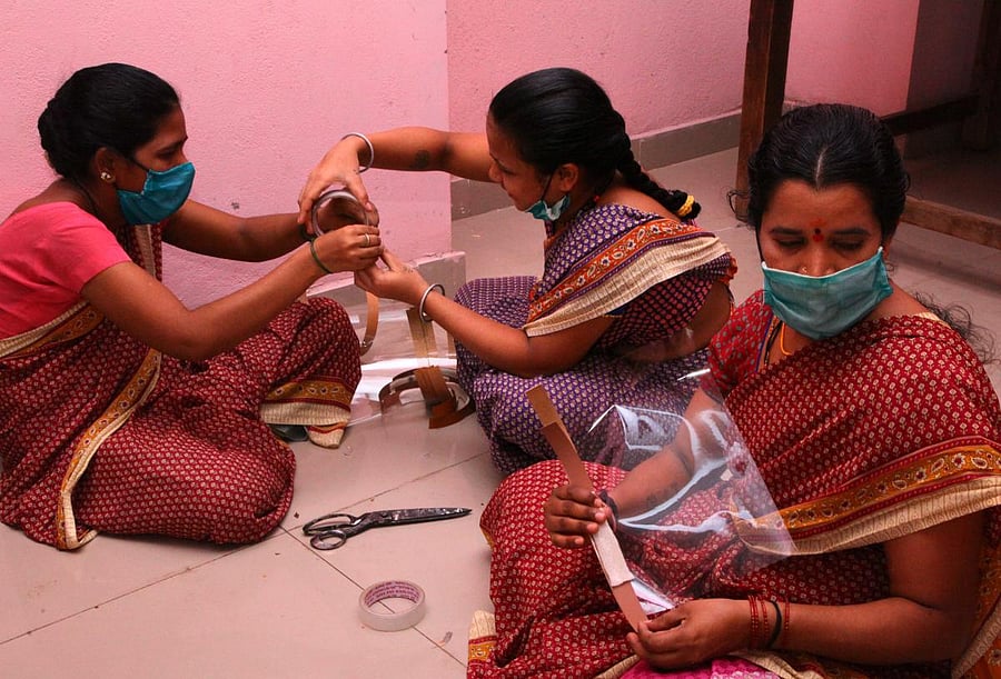Women sheltered at the orphan home busy making masks in Ballari.