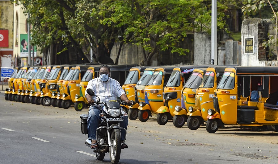 A man rides a bike as autorickshaws stand parked during 'Janata curfew' in the wake of coronavirus pandemic, in Chennai, Sunday, March 22, 2020. Credit: PTI Photo