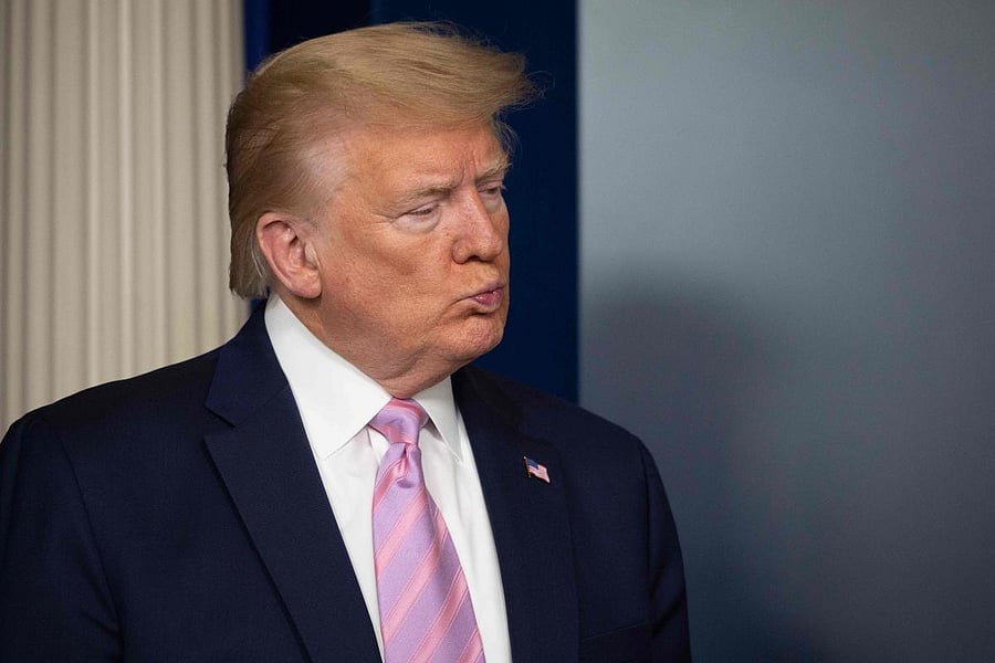 US President Donald Trump listens during the daily briefing on the novel coronavirus, which causes COVID-19, in the Brady Briefing Room at the White House on April 10, 2020, in Washington, DC. Credit: AFP Photo
