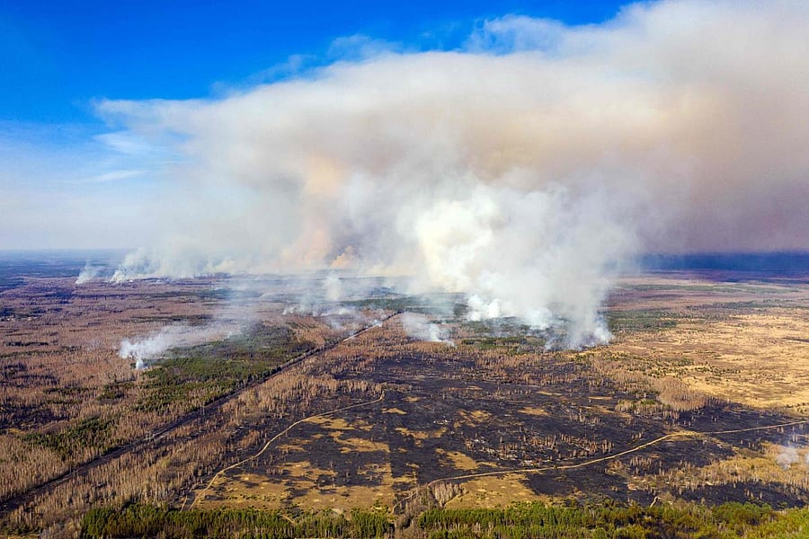 This aerial picture taken on April 12, 2020 shows a forest fire burning at a 30-kilometer (19-mile) Chernobyl exclusion zone in Ukraine, not far from the nuclear power plant. Credit: AFP Photo
