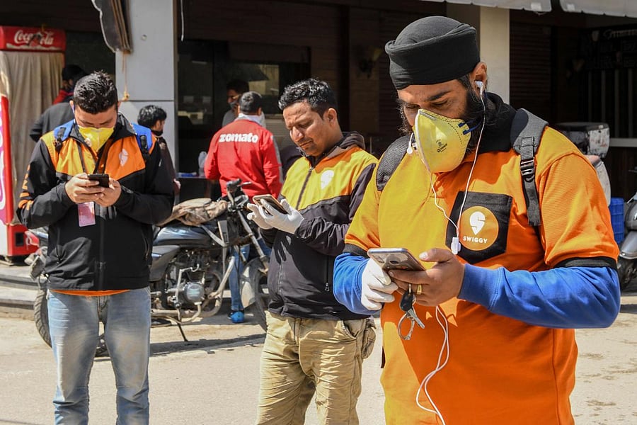 Swiggy delivery men (AFP Photo)