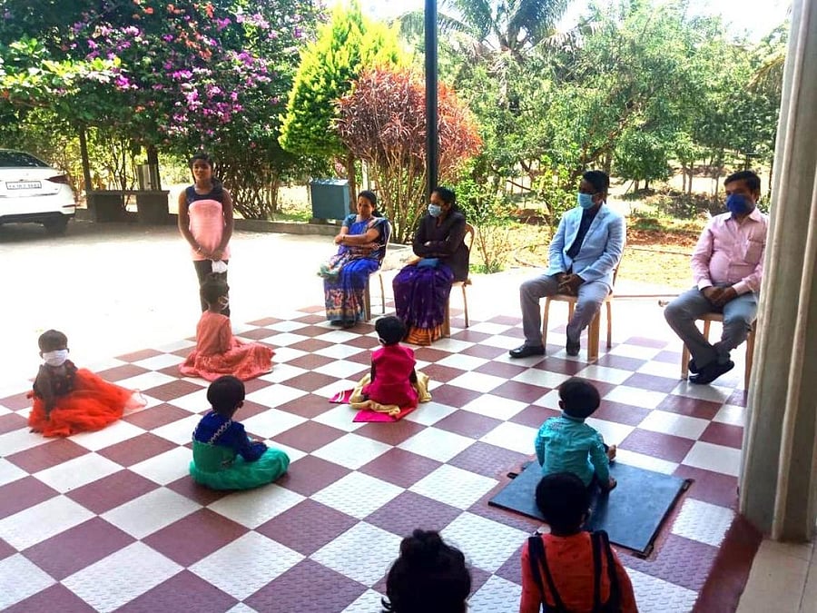 District legal services authority member secretary Basavaraj Chengati and others during a visit to an adoption centre in Chikkamagaluru.