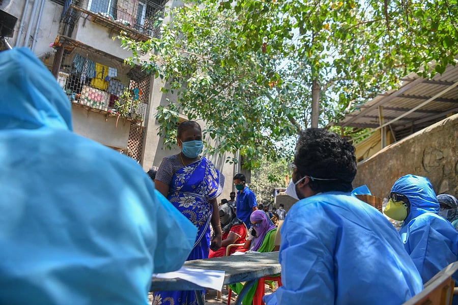  In this file photo taken on April 16, 2020, doctors listen to a resident at a COVID-19 coronavirus testing drive inside the Dharavi slum during a government-imposed nationwide lockdown as a preventive measure against the spread of the COVID-19 coronavirus, in Mumbai. Credit: AFP Photo