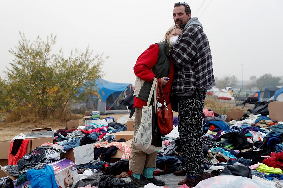 Travis Lee Hogan, of Paradise, comforts his mother, Bridgett Hogan, while they stay at a makeshift evacuation center for people displaced by the Camp Fire in Chico, California. Reuters Photo 