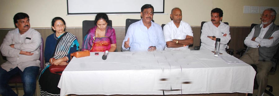 Former minister H C Mahadevappa addresses the media in Madikeri.