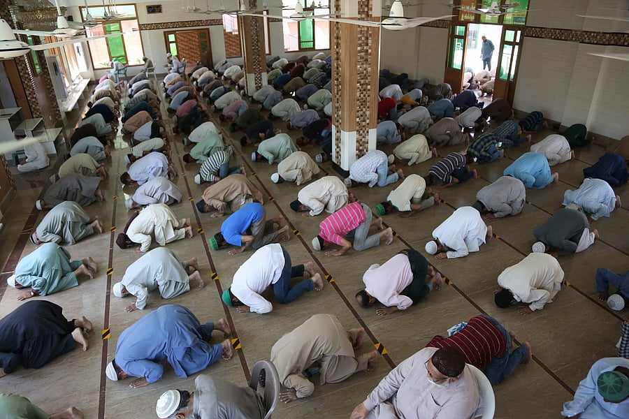 People attend evening prayers while maintaining a level of social distancing to help avoid the spread of the coronavirus, at a mosque in Karachi, Pakistan. (AP Photo)