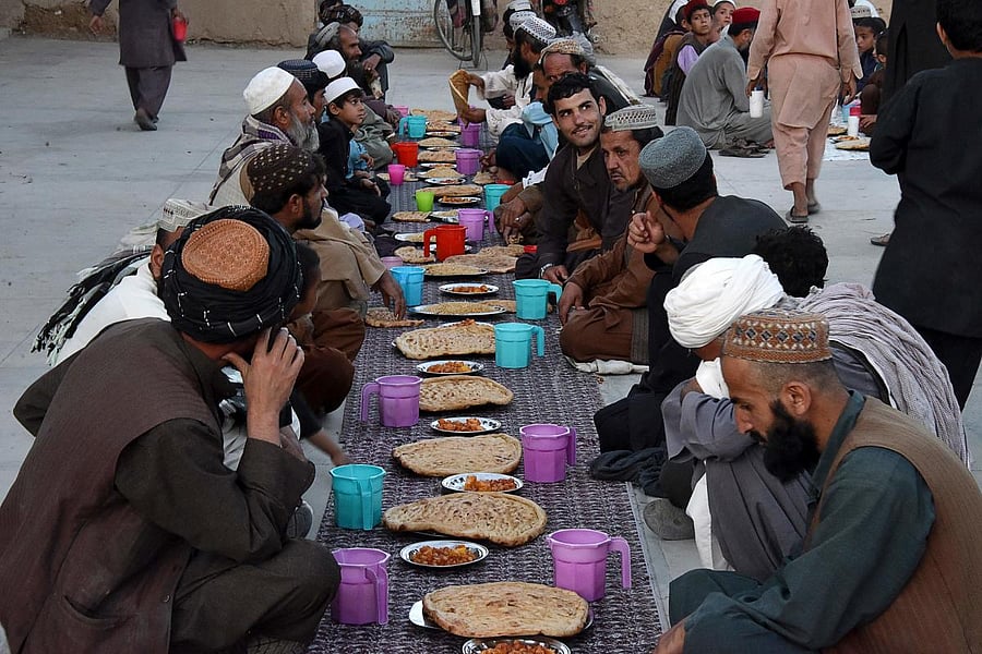 Afghan Muslims wait to break their fast during the Islamic holy month of Ramadan at a mosque in Kandahar. Credit: AFP Photo
