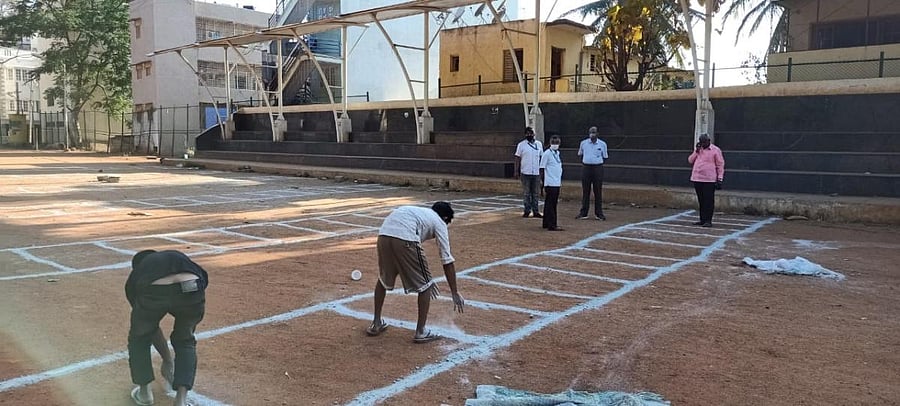 BBMP officials convert a playground into a vegetable market to avoid congregation of people in large numbers at markets.
