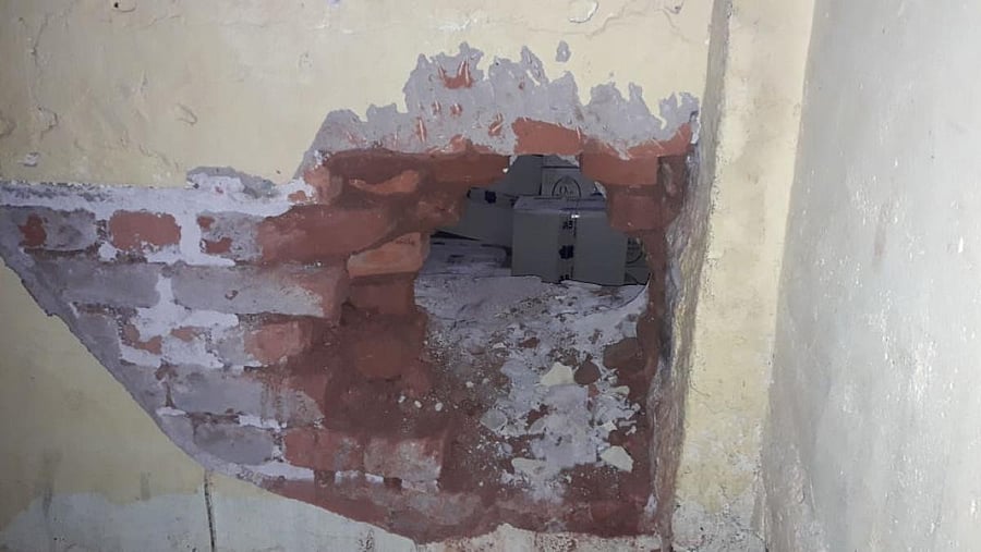 Miscreants drilled hole on the wall of Balaji Wines on B B Road in Chikkaballapur to gain entry inside