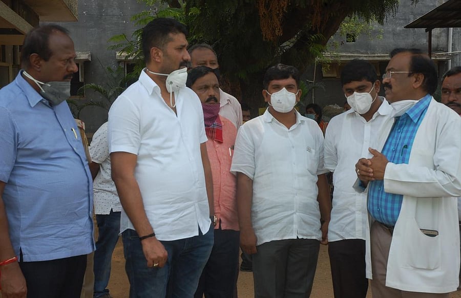 MLCs R Chodwa Reddy and C R Manohar receive updates on Covid-19 in the district at SNR district hospital on Saturday.