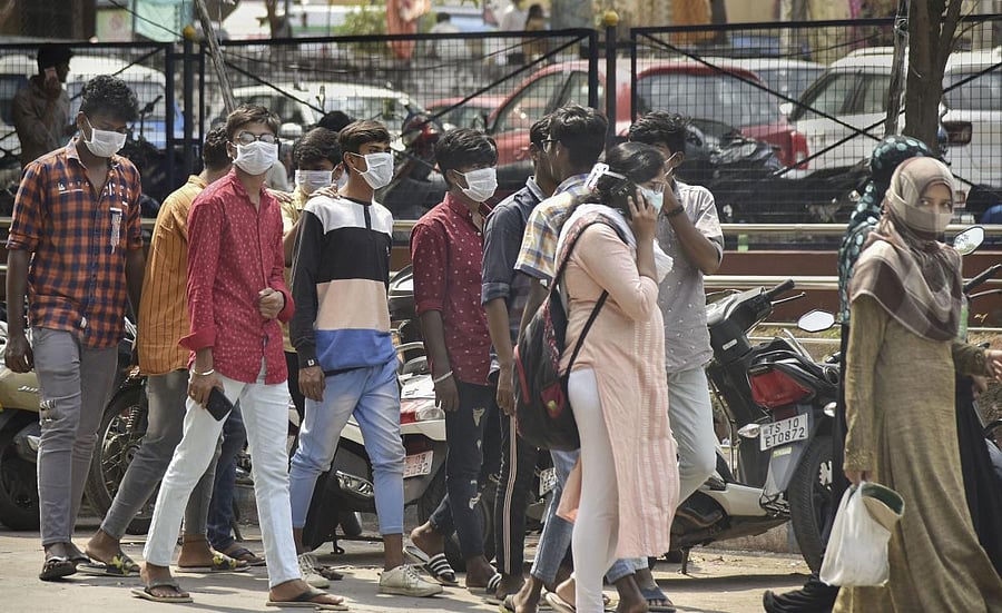 Visitors wear protective masks in wake of the deadly novel coronavirus, at Government Gandhi Hospital in Hyderabad, Tuesday, March 3, 2020. Credit: PTI Photo