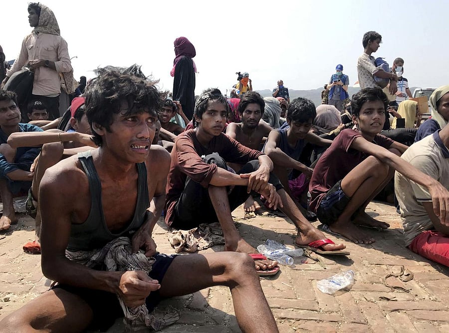 Refugees after being rescued (AP Photo)