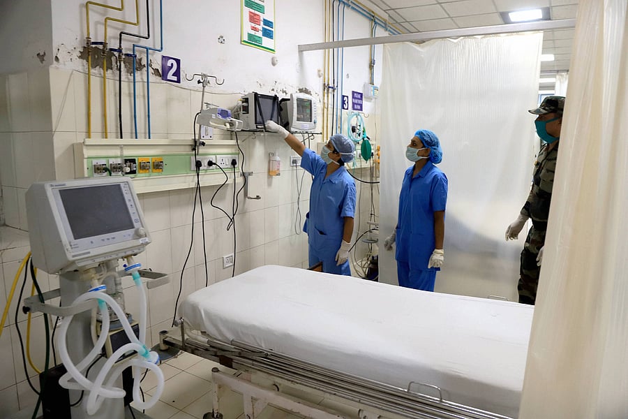Nurses work for setting up of a quarantine facility for COVID-19 cases, during ongoing nationwide lockdown, at an Army hospital in Prayagraj. (PTI Photo)