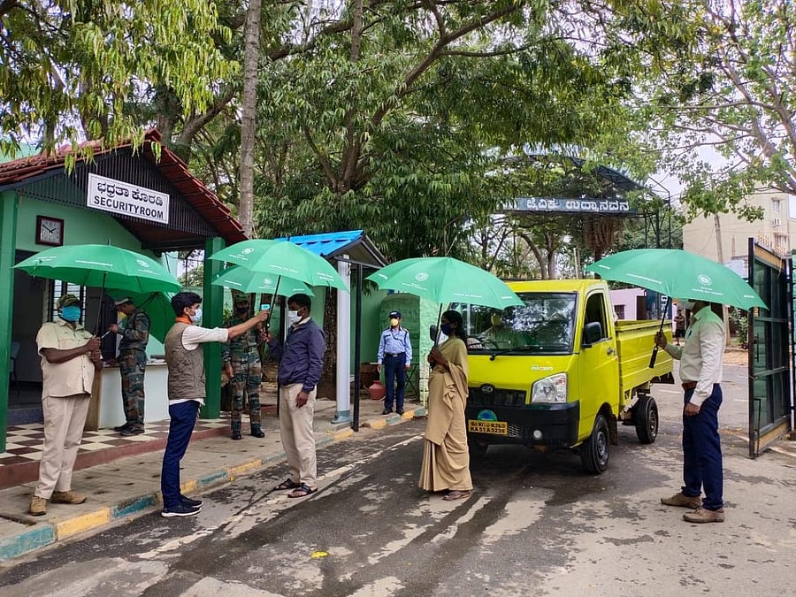 BBP officials experiment with umbrellas to ensure strict implementation of the social distancing rules post lockdown. Special Arrangement