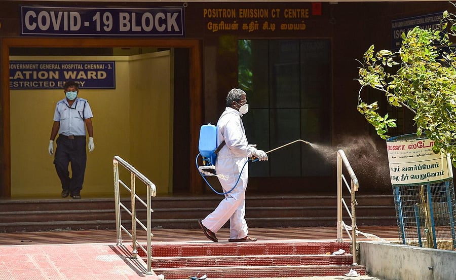 A health worker sprays disinfectant at Rajiv Gandhi Government General Hospital, during a government-imposed nationwide lockdown as a preventive measure against the coronavirus. PTI