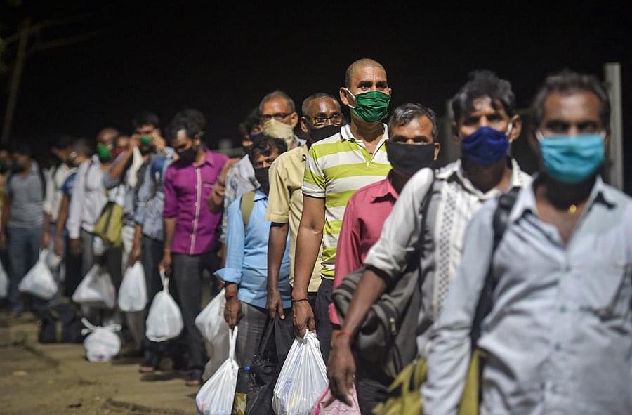 Migrants from various northern states of India wait to board a special train for Gorakhpur, during the ongoing COVID-19 lockdown, in Bhiwandi, Saturday, May 2, 2020. (PTI Photo)