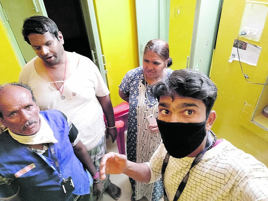 Volunteers extend a helping hand to a needy family.