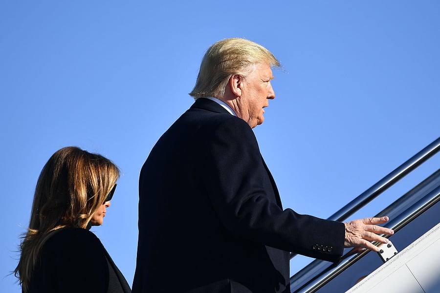 US President Donald Trump and First Lady Melania Trump make their way to board Air Force One before departing from Andrews Air Force Base in Maryland. (AFP Photo)
