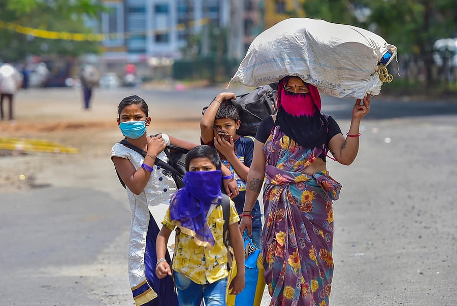 Bengaluru: Stranded people arrive at Majestic Bus Station to board buses to reach their native places during the nationwide lockdown imposed in wake of the coronavirus pandemic, in Bengaluru, Wednesday, May 6, 2020. (PTI Photo/Shailendra Bhojak)(PTI06-05-