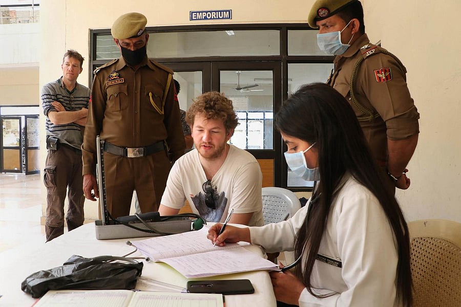 A German tourist undergoes a screening test in wake of the deadly novel coronavirus, on Jammu-Pathankot National Highway at Lakhanpur about 80kms from Jammu, Wednesday, March 4, 2020. (PTI Photo)