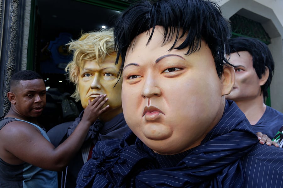 Giant puppets representing US President Donald Trump (L) and North Korea's leader Kim Jong-un are seen during a traditional carnival parade through the streets of Recife in northeastern Brazil. (AFP Photo)