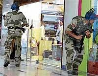 Some members of the Navi Mumbai Police & Commando unit, created in the aftermath of the 26/11 terror attack last year, demonstrate their skills at a mall in Mumbai on Wednesday. PTI
