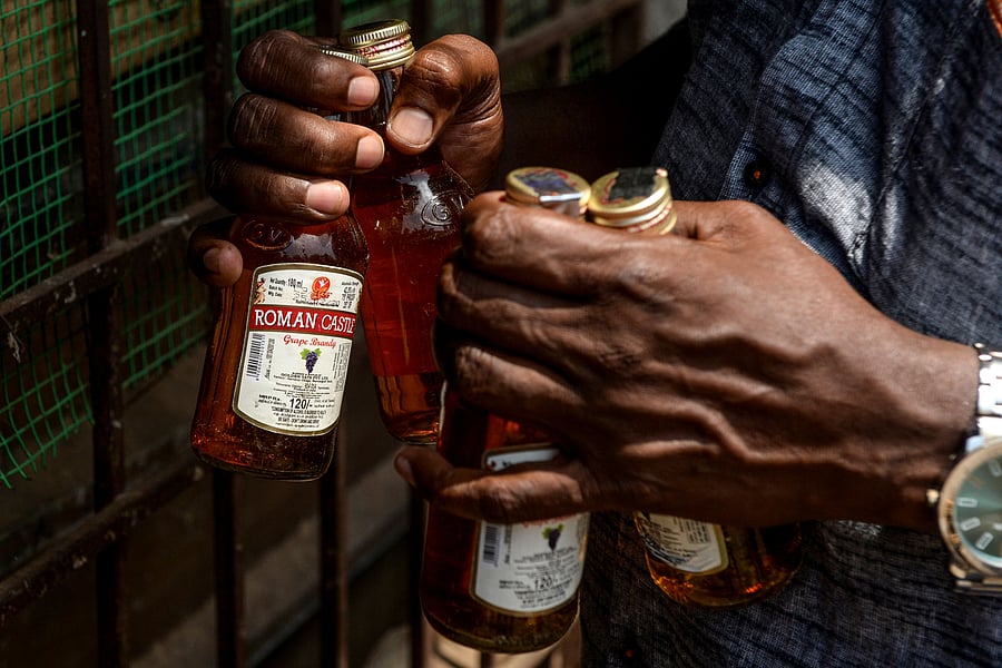 Providing details about the "corona cess", a spokesperson said an additional license fee of Rs 5 per bottle on country-made liquor, Rs 10 per bottle on IMFL. (Credit: AFP Photo)