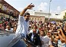 Acting Venezuelan President Nicolas Maduro waves to supporters as he leaves after voting for the successor to the late President Hugo Chavez, in Caracas April 14, 2013. Reuters