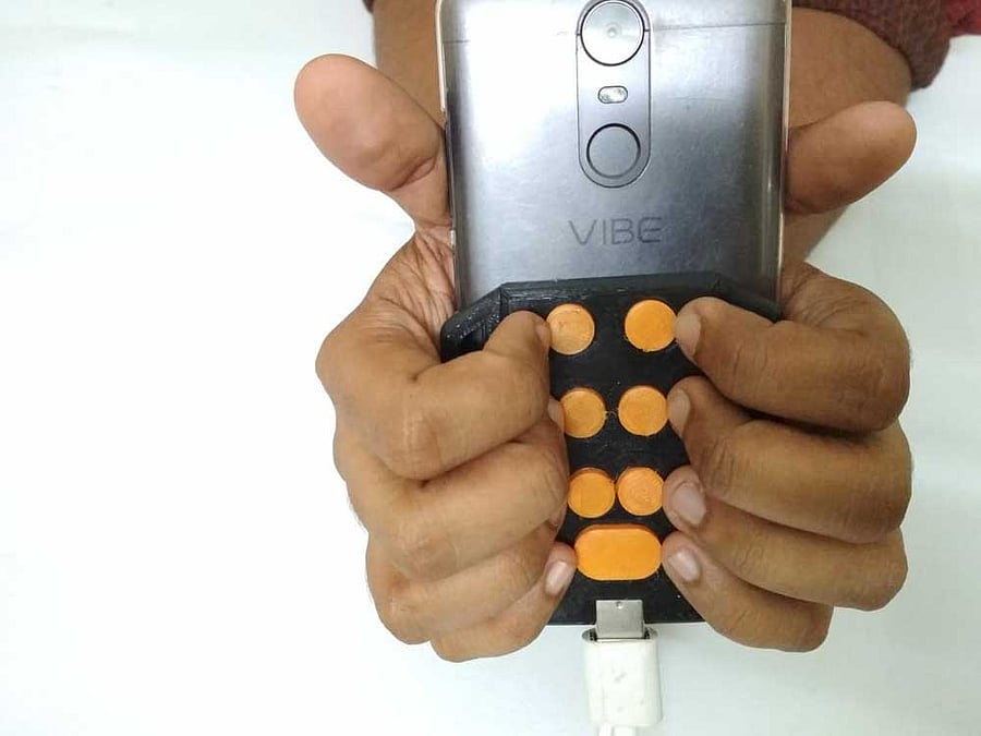 Braille keypad 'Tipo' can be attached to smartphones to improve accessibility.