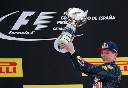 Red Bull F1 driver Max Verstappen of The Netherlands holds trophy after winning Spanish Grand Prix. REUTERS