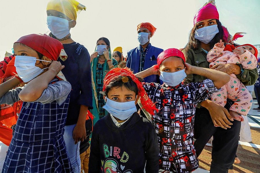  People wear protective masks during a campaign by Delhi Sikh Gurudwara Management Committee to distribute masks in the wake of novel coronavirus scare in New Delhi, Sunday, March 8, 2020. (PTI Photo)
