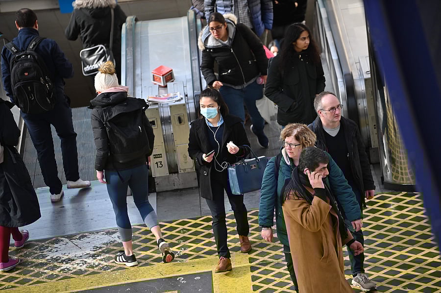 Pssenger wearing a mask is seen at Waterloo Station in the morning in London. (AFP Photo)