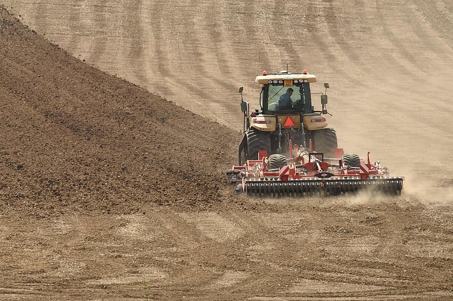 A farmer ploughs a field near Pontefract, northern England, on April 23, 2020 as life continues under lockdown in the UK to help halt the transmission of the COVID-19 illness. Credit: AFP Photo