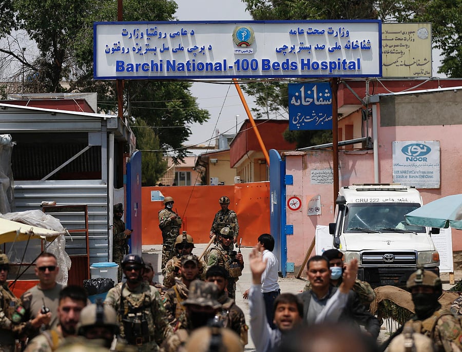 fghan security forces stand guard outside Dasht-e-Barchi Hospital which came under attack in Kabul, Afghanistan. (REUTERS Photo)