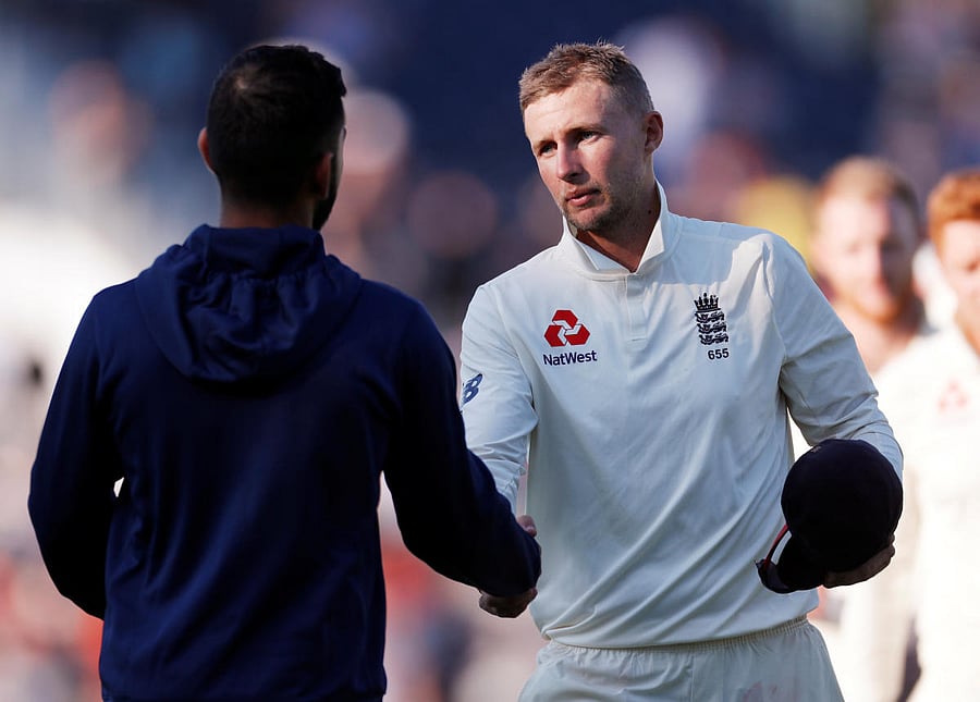 England's Joe Root shakes the hand of India's Virat Kohli after the match. Reuters Photo