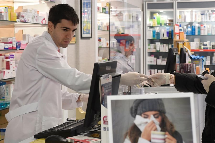 Spanish footballer Toni Dovale has put his football boots to one side and slipped into a pharmacist's white coat, joining the struggle against coronavirus in his country. AFP