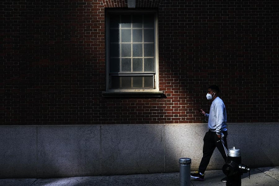 A man walks through the Financial District on May 11, 2020 in New York City. Credit: AFP Photo