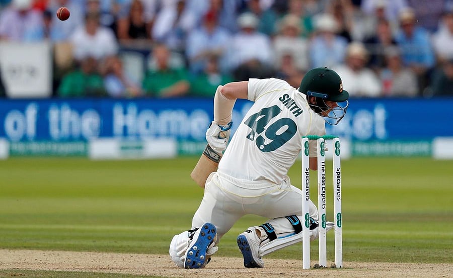 Australia's Steve Smith falls to the pitch after being hit in the head by a ball off the bowling of England's Jofra Archer. (AFP file photo)