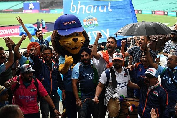 Indian fans celebrate as India's team qualify for the Twenty20 women's World Cup cricket final in Sydney on March 5, 2020. (AFP Photo)