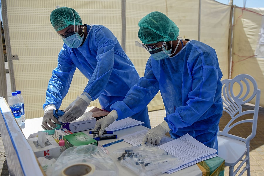 The National Coordination Committee headed by Prime Minister Imran Khan meets every day to evolve the response to the COVID-19 treat. (Credit: AFP Photo)