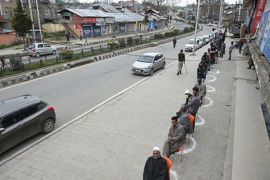 People maintain a safe distance, in wake of the coronavirus pandemic. (PTI Photo)