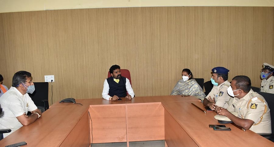 MP S Muniswamy chairs a meeting to create awareness about Covid-19 in Kolar on Friday.