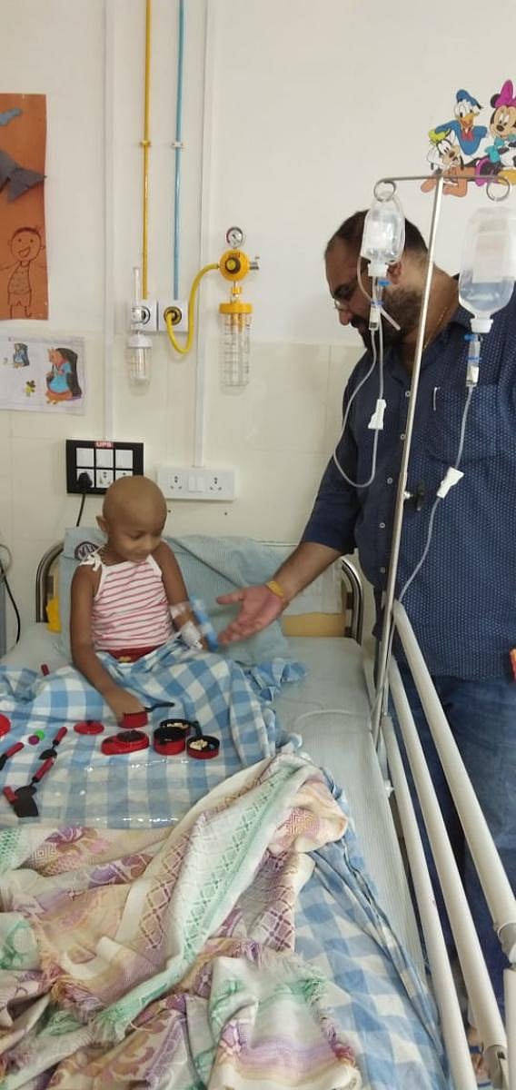 Arjun Bhandarkar with a kid in Dakshina Kannada.