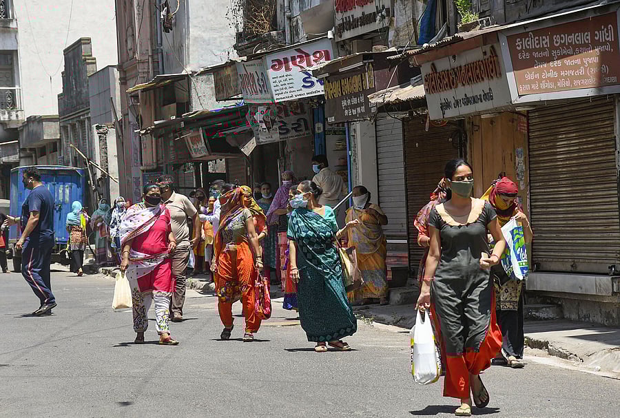 People visit a market to buy essential items during the nationwide lockdown imposed to contain the spread of COVID-19 pandemic. (PTI Photo)