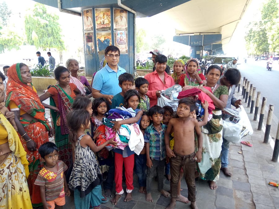 Atul Pandya with underprivileged people.