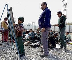 fresh air in education Ravinder Singh Rawat, a teacher, watches a student solve a math problem in an open air classroom at Kandoli Raipur elementary school in Uttarakhand. NYT