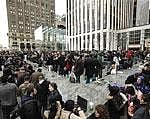 Customers stand in line outside of Apple's flagship 5th Avenue store to purchase iPad 2 tablets in New York on Friday. Reuters
