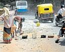 DH impact: Workers of the BBMP repair the stretch in front of the IISc main gate (towards Mekhri Circle) that had turned an accident zone. Deccan Herald on Friday published a series of photos depicting the road damaged by the BWSSB to replace the water pipeline and led to accident. DH Photo