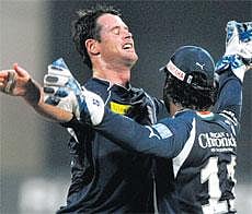 ON CLOUD NINE: Daniel Christian of Deccan Chargers celebrates with skipper Kumar Sangakkara after dismissing PuneWarriors skipper Yuvraj Singh in Mumbai on Monday. AFP